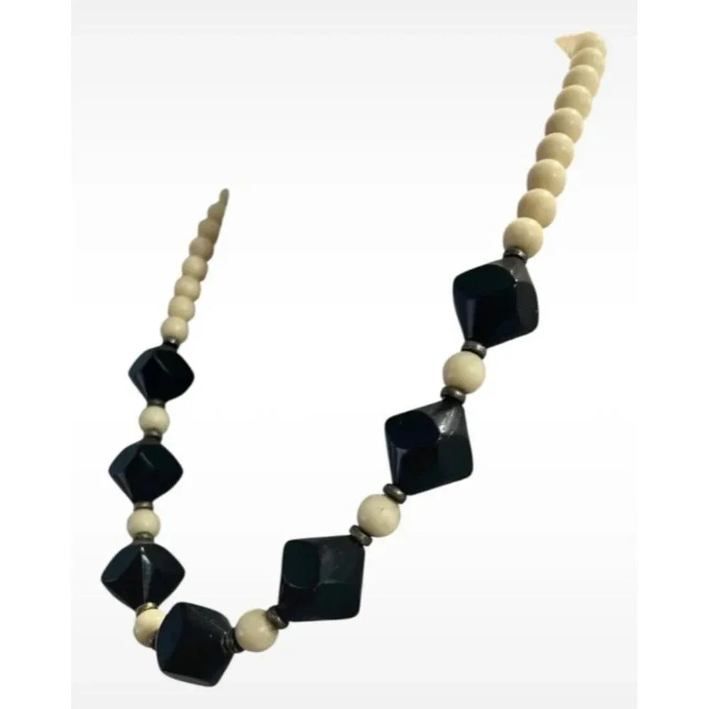 Vintage beaded necklace graduated sizes 22” long Cream and black